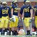 Michigan running back Fitzgerald Toussaint, running back Drake Johnson, fullback Joe Kerridge and fullback Sione Houma stand on the sideline during spring practice at Michigan Stadium on Saturday, April 13, 2013. Melanie Maxwell I AnnArbor.com